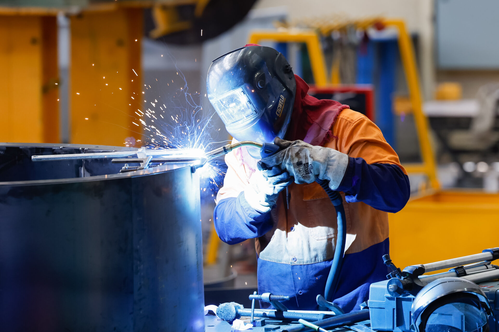 Worker welding steel